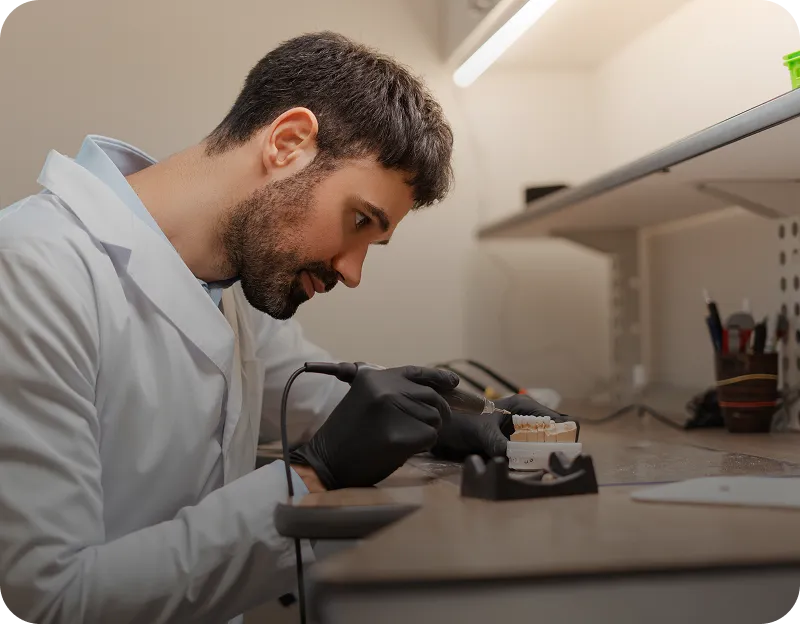 Technician working on dental model